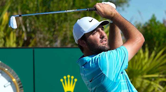 Scottie Scheffler watches his shot from the 2nd tee during the final round of the Hero World Challenge at the Albany Golf Club, in New Providence, Bahamas, Sunday, Dec. 3, 2023.